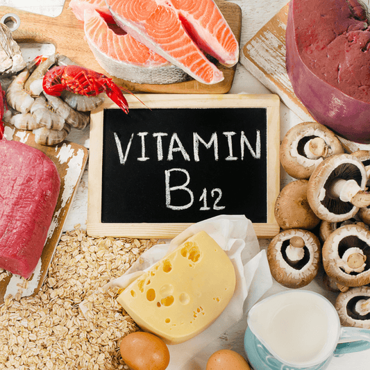 Vitamin B12 rich foods including salmon, shrimp, beef, cheese, milk, eggs, mushrooms, oats on table