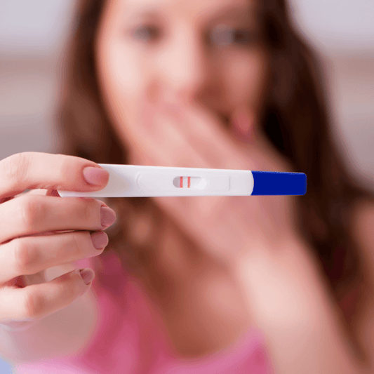 Woman holding positive pregnancy test, wellness and skincare concept from WEDOART-IL