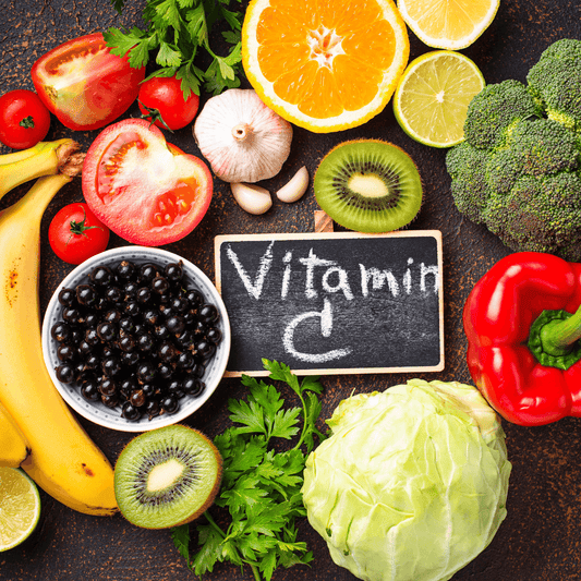 Fresh fruits and vegetables rich in vitamin C with a chalkboard sign, skincare nutrition concept