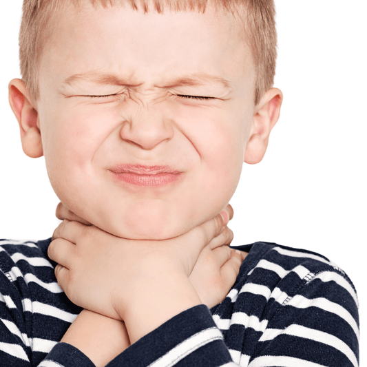 Young boy in striped shirt holding sore throat, looking distressed, on white background