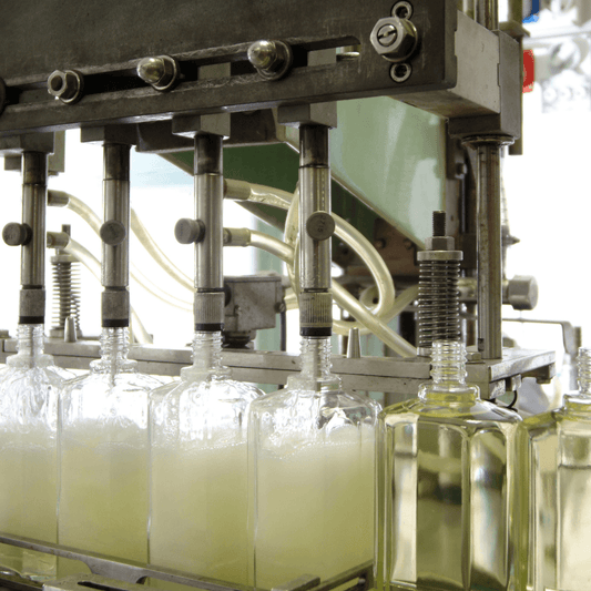 Cosmetic skincare bottles being filled on a production line at WEDOART-IL facility