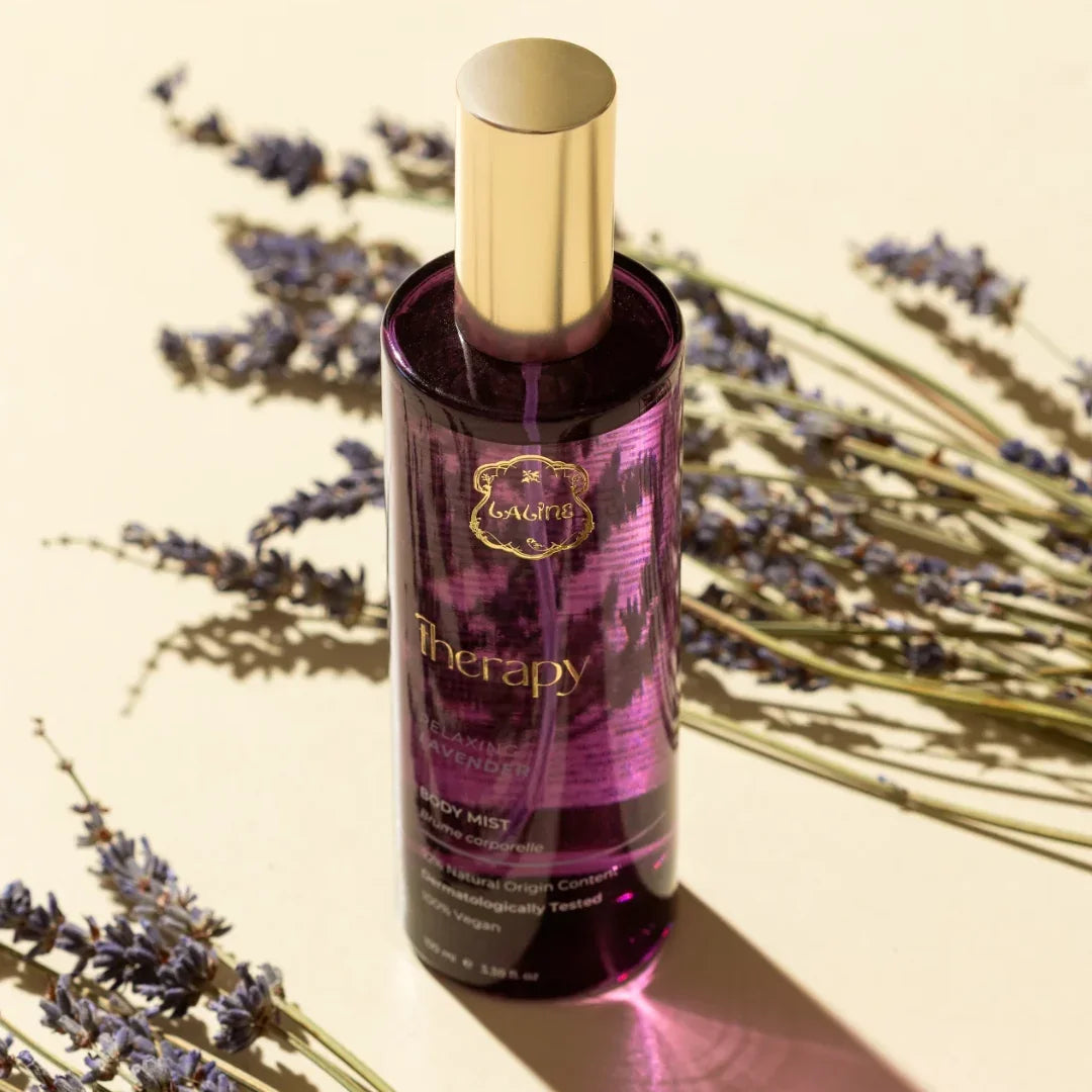 Laling Therapy Relaxing Lavender Body Mist bottle placed among dried lavender sprigs.