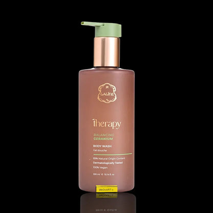 Therapy Balancing Geranium Body Wash in a brown pump bottle on a black background.