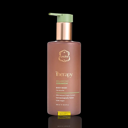 Therapy Balancing Geranium Body Wash in a brown pump bottle on a black background.