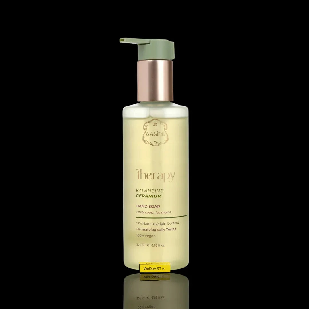 Therapy Balancing Geranium Hand Soap pump bottle against a black background.