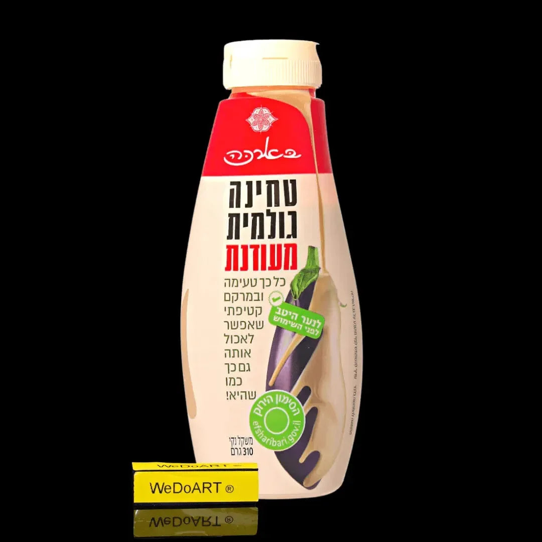 Baraka delicate sesame tahini in a 310 g squeeze bottle with a white cap and red label on a black background