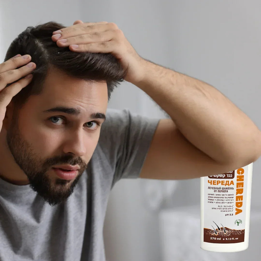 Man running a hand through his hair with a CHEREDA shampoo 270 ml bottle beside him