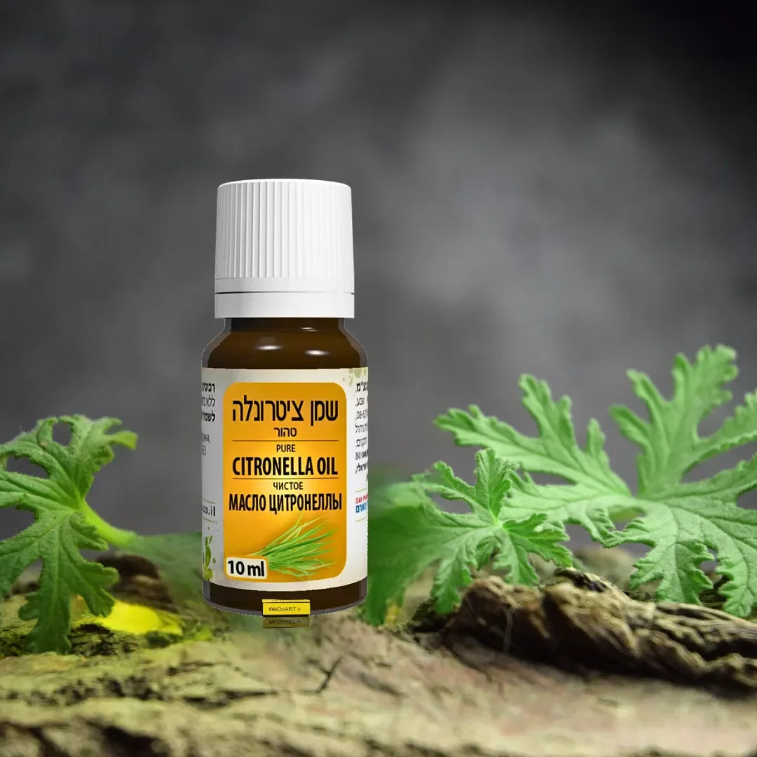 Dan Pharm citronella oil 10 ml bottle standing on bark among green leaves