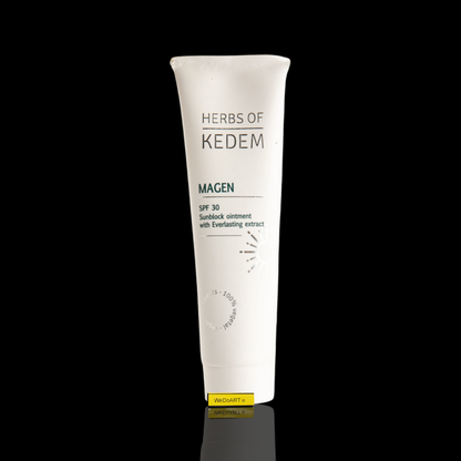 Herbs of Kedem Magen SPF 30 sunscreen ointment tube, 100 ml, on a dark WEDOART-IL background