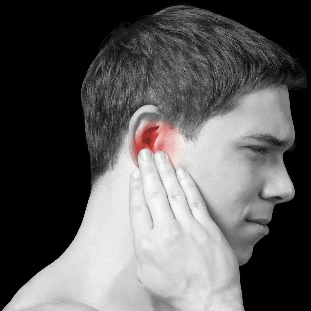 Black-and-white portrait of a man holding his hand to his ear with a red highlight