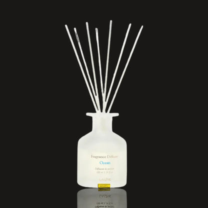 Laline Ocean reed diffuser 100 ml in a frosted white glass bottle with a bundle of white reeds