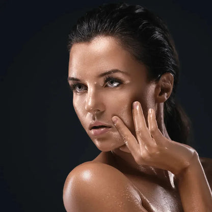 Close-up of a woman with a fresh, glowing face
