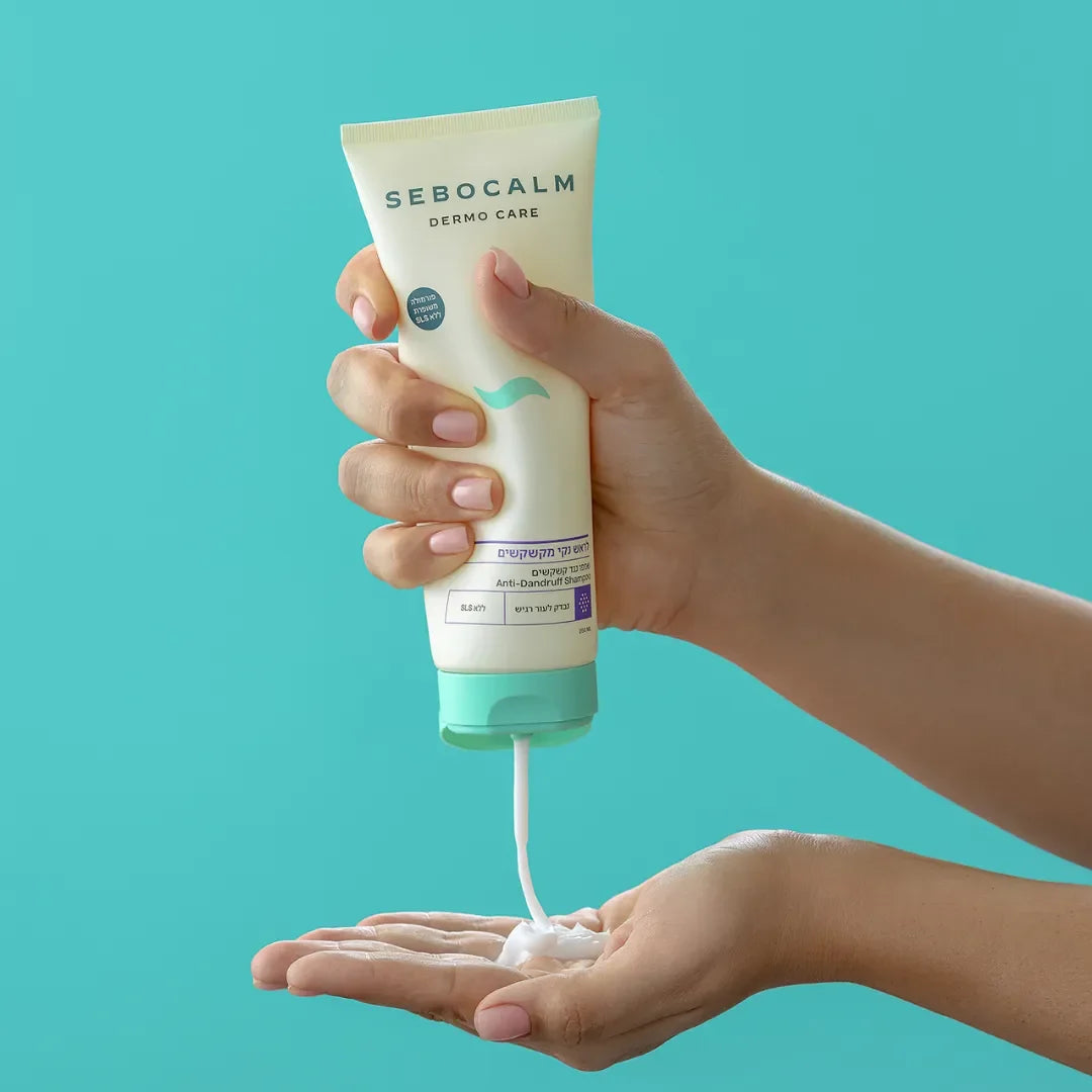 Shampoo being squeezed from the SeboCalm tube into an open palm