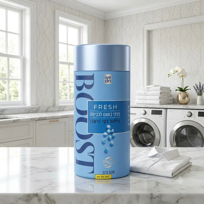 Blue BOOST Fresh laundry detergent on marble counter with folded shirts and washing machines