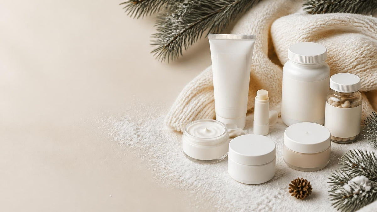 Winter skincare and wellness products with a cozy scarf and pine branches