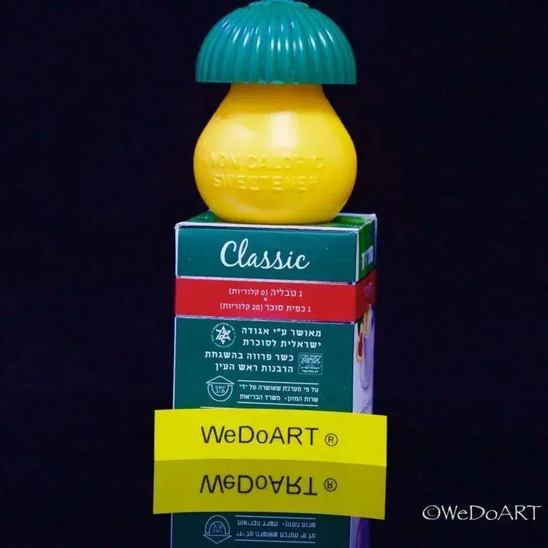 Lemon-shaped Sucrazit Classic dispenser resting on top of a stacked carton