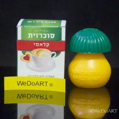 Two Sucrazit Classic cartons with the lemon-shaped dispenser between them